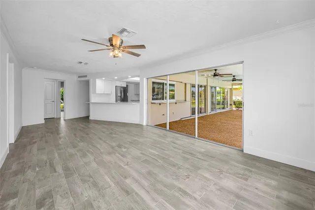a view of a livingroom with a ceiling fan