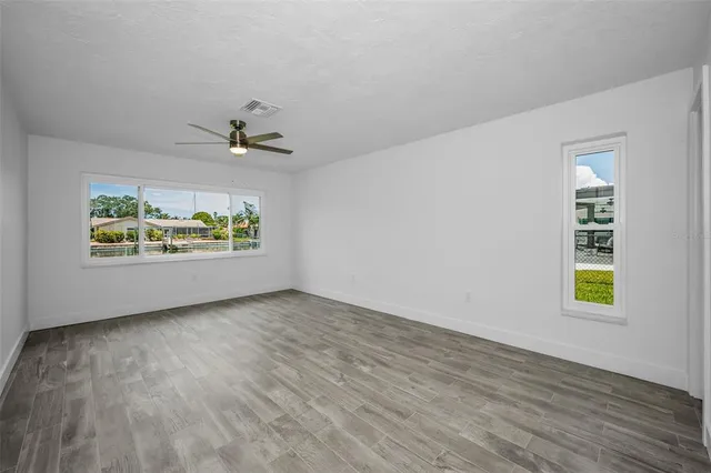 an empty room with window and windows