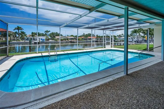 a view of a backyard with sitting area