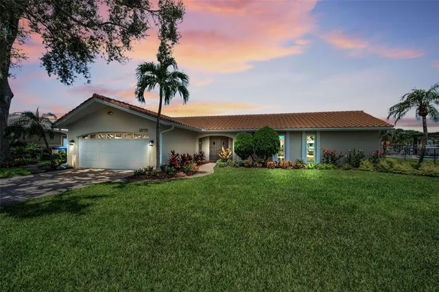 a front view of house with yard and outdoor seating
