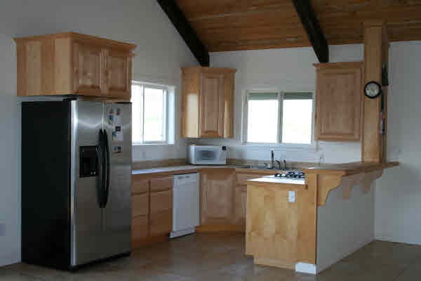 5100 Alii Road Hanapepe, HI 96716 - Photo 3 of 16 a kitchen with a sink a refrigerator and window