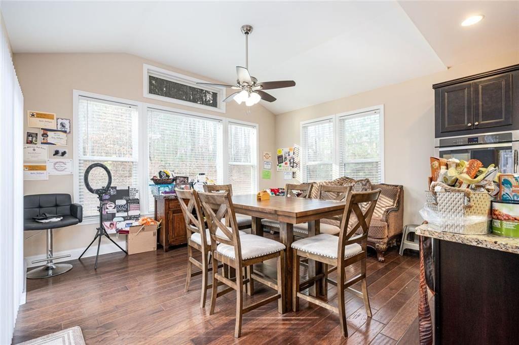 2020 Youngstown Place Powder Springs, GA 30127 - Photo 12 of 25 a view of a dining room with furniture window and wooden floor