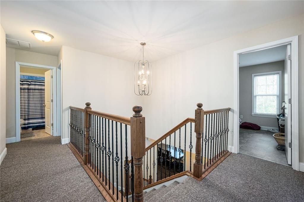 2020 Youngstown Place Powder Springs, GA 30127 - Photo 15 of 25 a view of a hallway with windows and stairs