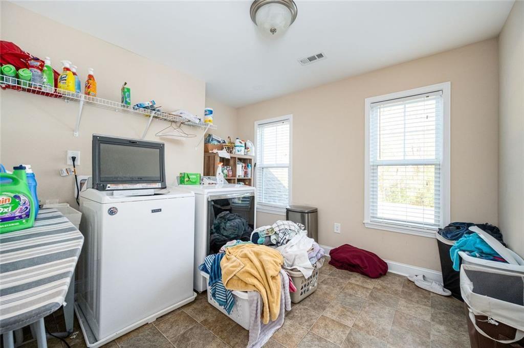 2020 Youngstown Place Powder Springs, GA 30127 - Photo 22 of 25 a bedroom with a bed and flat screen tv