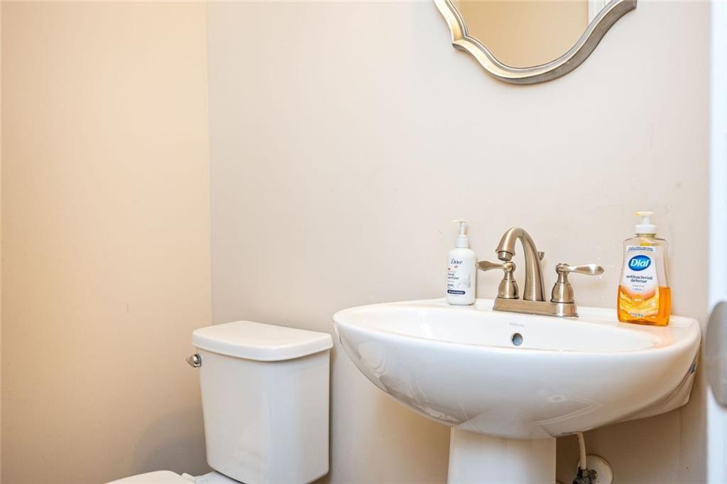 2020 Youngstown Place Powder Springs, GA 30127 - Photo 5 of 25 a bathroom with a sink a toilet and a mirror