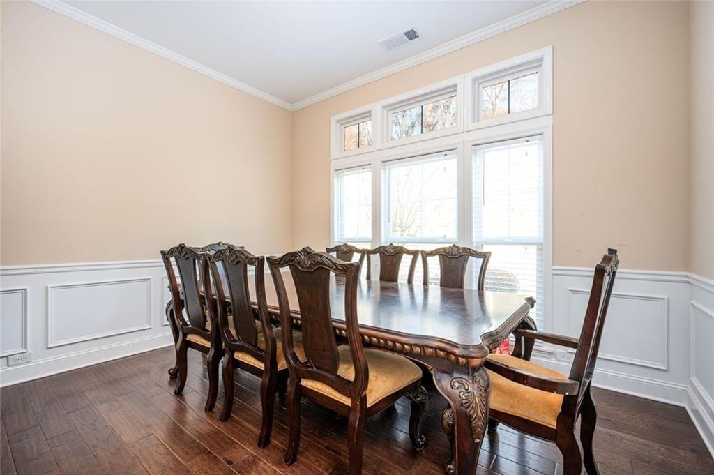 2020 Youngstown Place Powder Springs, GA 30127 - Photo 6 of 25 a view of a dining room with furniture window and wooden floor