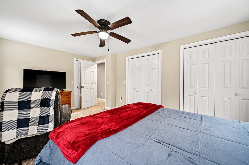 183 Freeman Road Charlton, MA 01507 - Photo 16 of 26 a bedroom with a bed and a flat screen tv