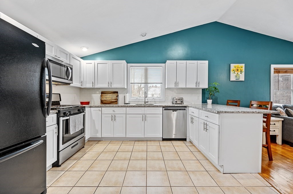 183 Freeman Road Charlton, MA 01507 - Photo 4 of 26 a kitchen with cabinets a sink and white stainless steel appliances