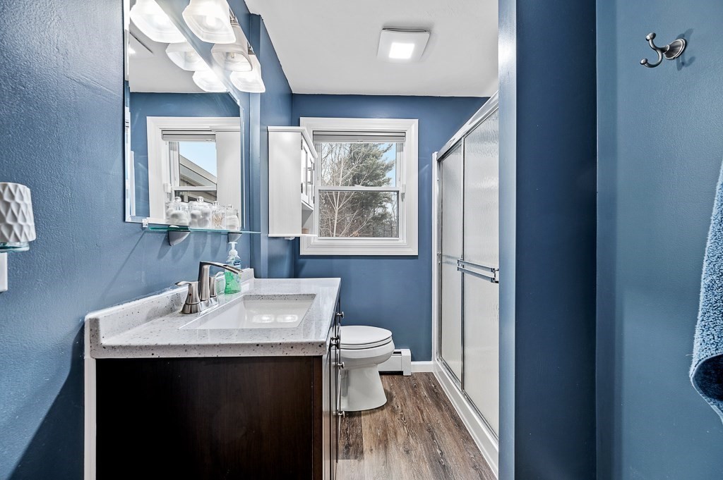 183 Freeman Road Charlton, MA 01507 - Photo 9 of 26 a bathroom with a sink a toilet and mirror