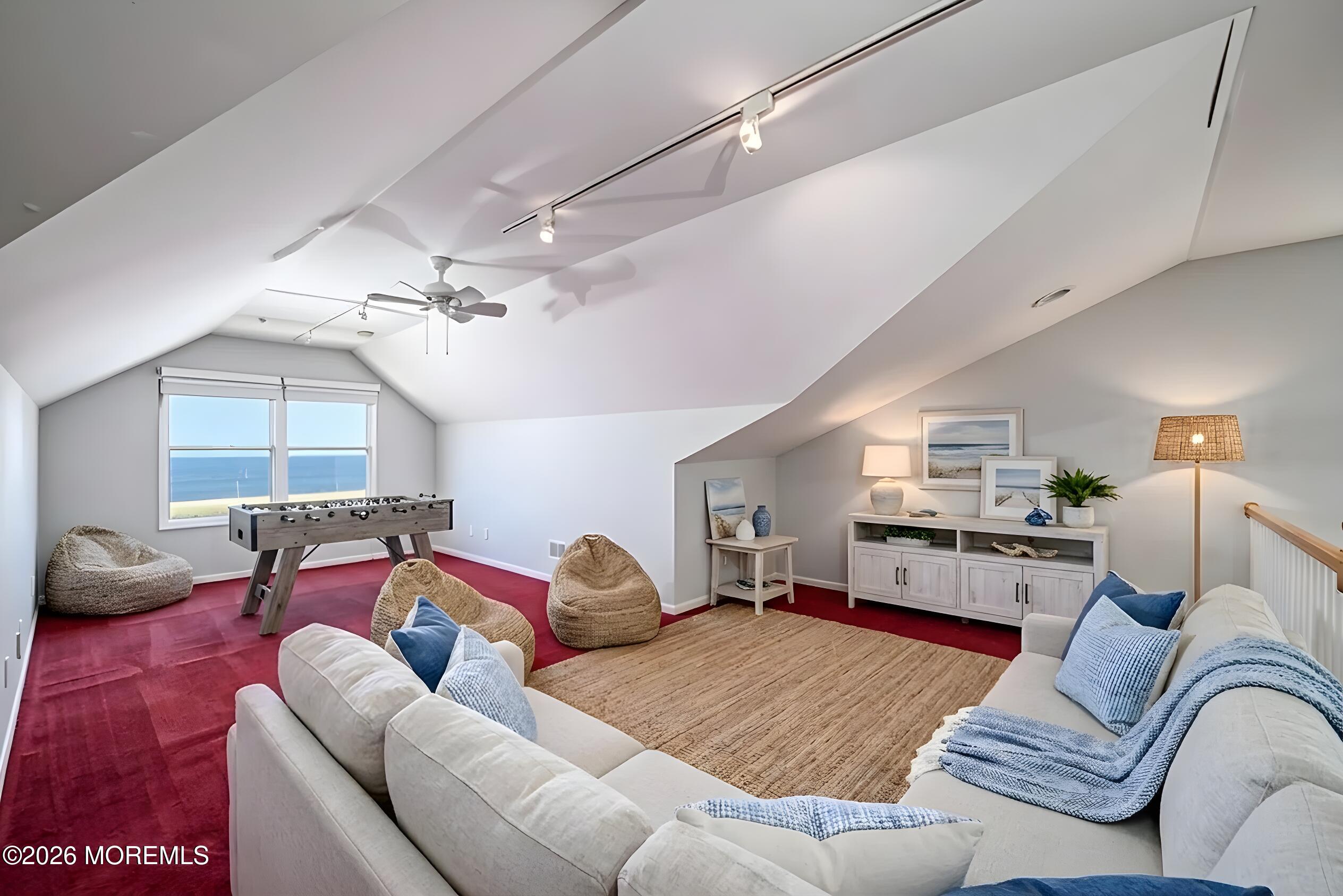 805 Front Street Union Beach, NJ 07735 - Photo 35 of 65 a bedroom with furniture and a chandelier