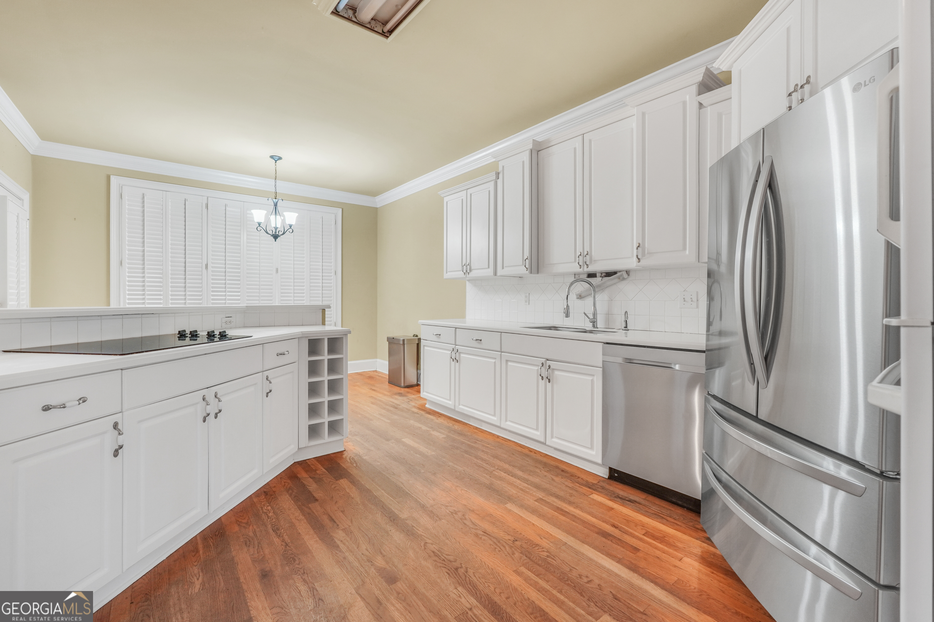 3003 Southwest East Fairview Road McDonough, GA 30252 - Photo 15 of 48 a kitchen with white cabinets and white appliances