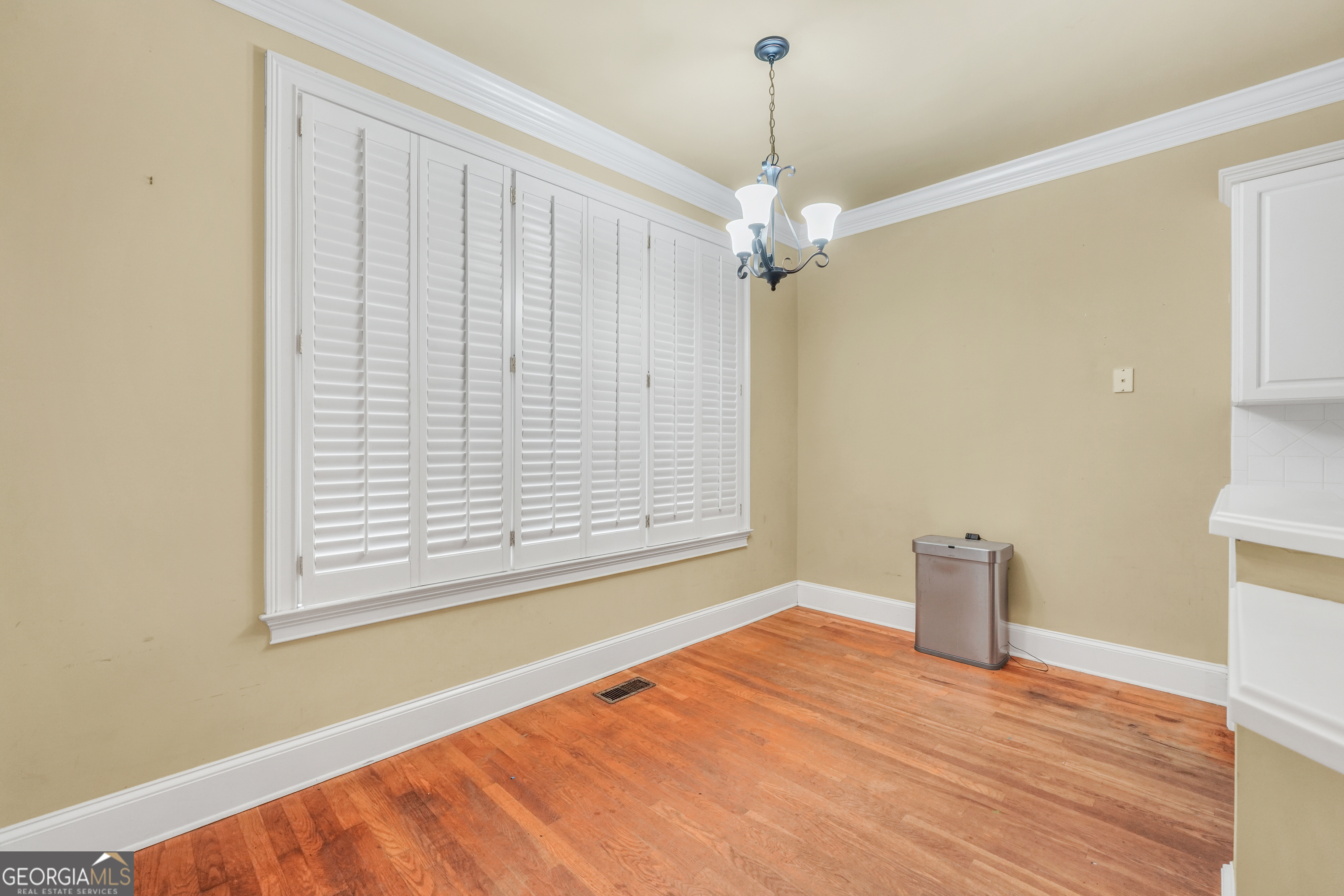 3003 Southwest East Fairview Road McDonough, GA 30252 - Photo 16 of 48 a view of empty room with wooden floor and fan