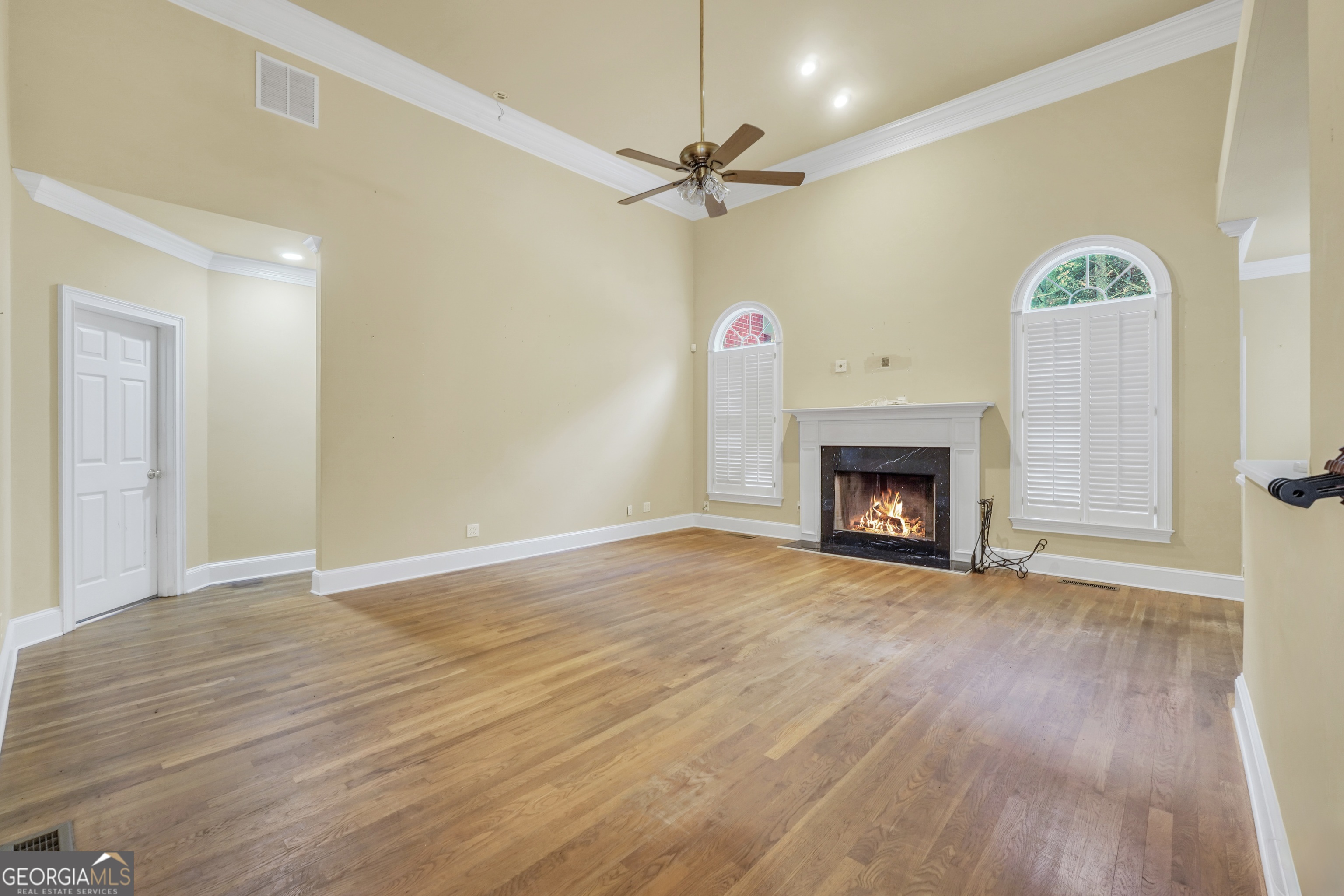 3003 Southwest East Fairview Road McDonough, GA 30252 - Photo 18 of 48 a view of an empty room with a fireplace and a window