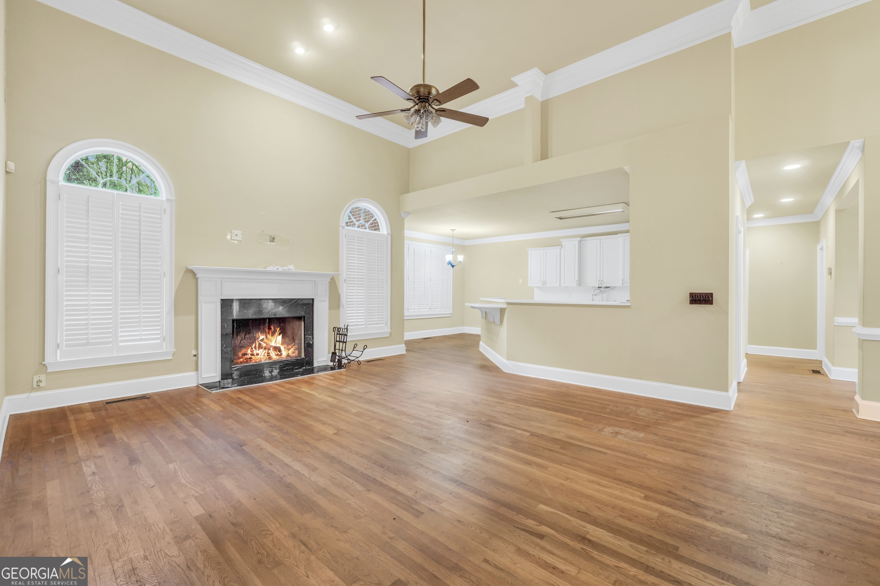 3003 Southwest East Fairview Road McDonough, GA 30252 - Photo 20 of 48 a view of an empty room with a fireplace and a window