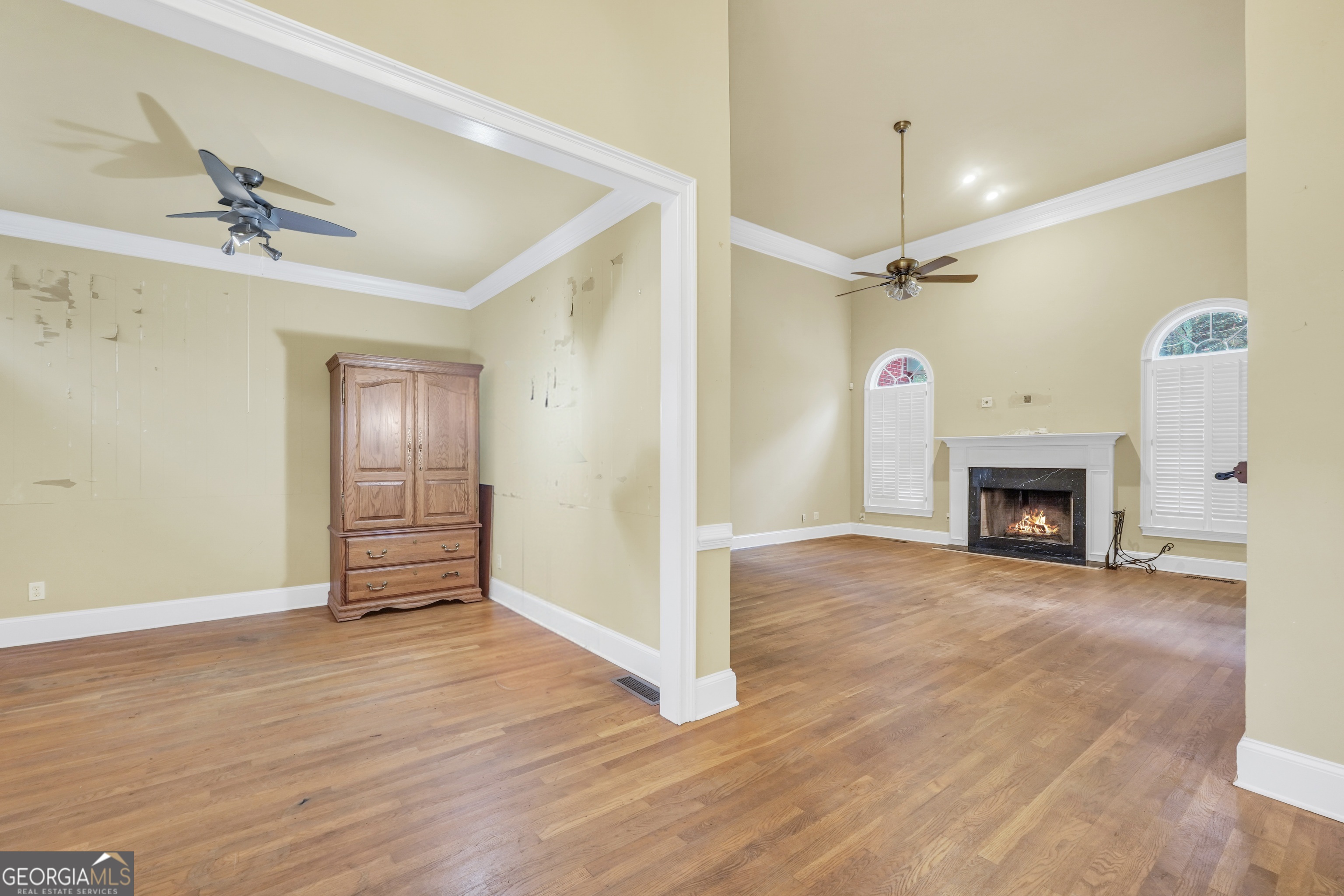 3003 Southwest East Fairview Road McDonough, GA 30252 - Photo 22 of 48 a view of a livingroom with wooden floor and a fireplace