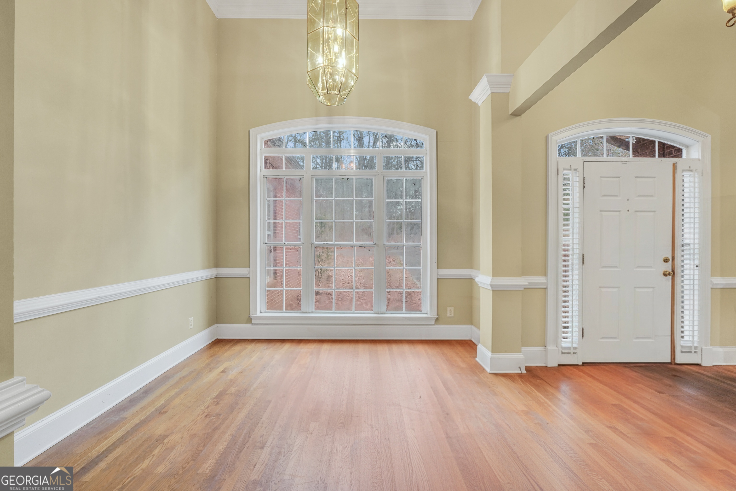 3003 Southwest East Fairview Road McDonough, GA 30252 - Photo 23 of 48 a view of an empty room with wooden floor and a window