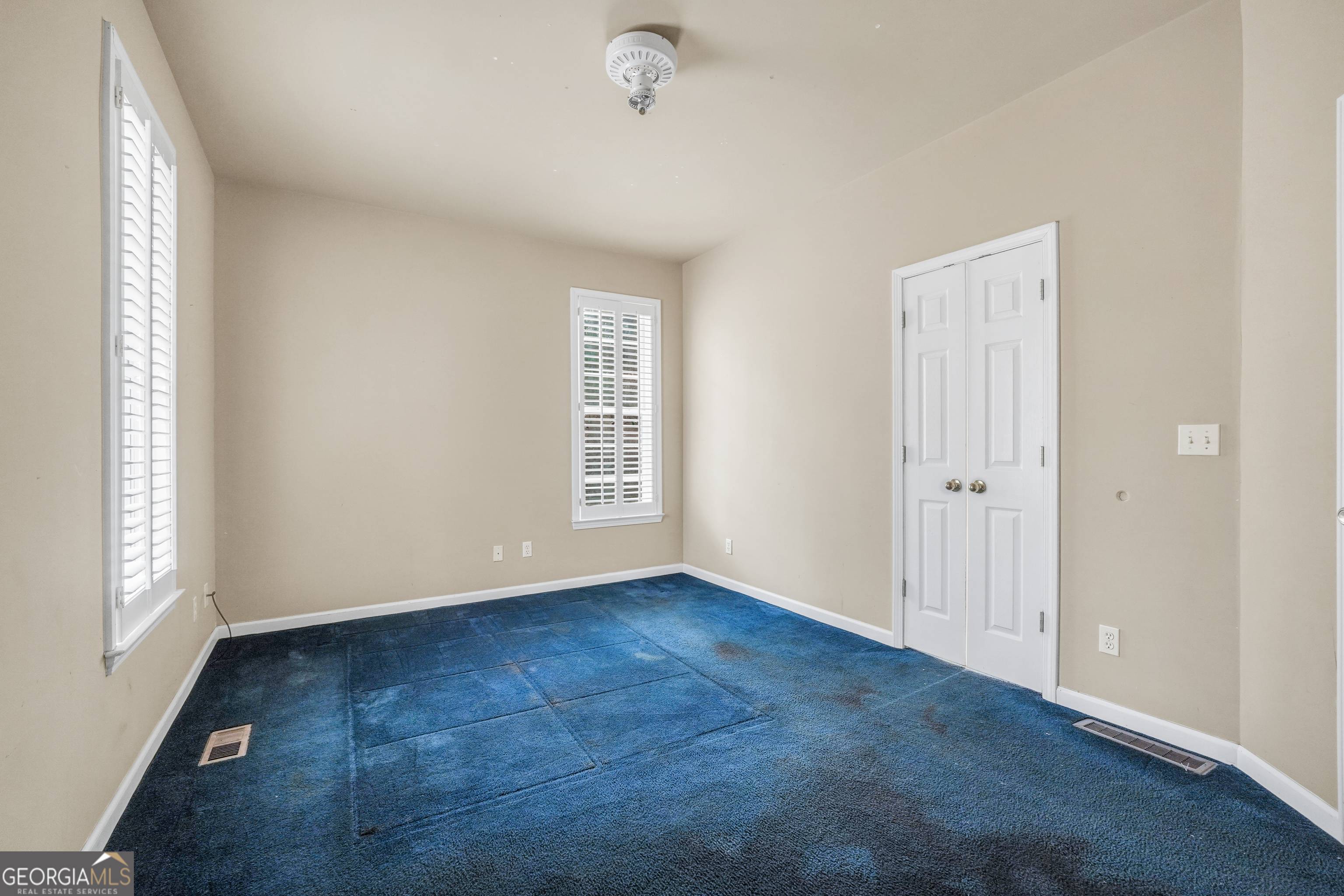 3003 Southwest East Fairview Road McDonough, GA 30252 - Photo 25 of 48 an empty room with windows