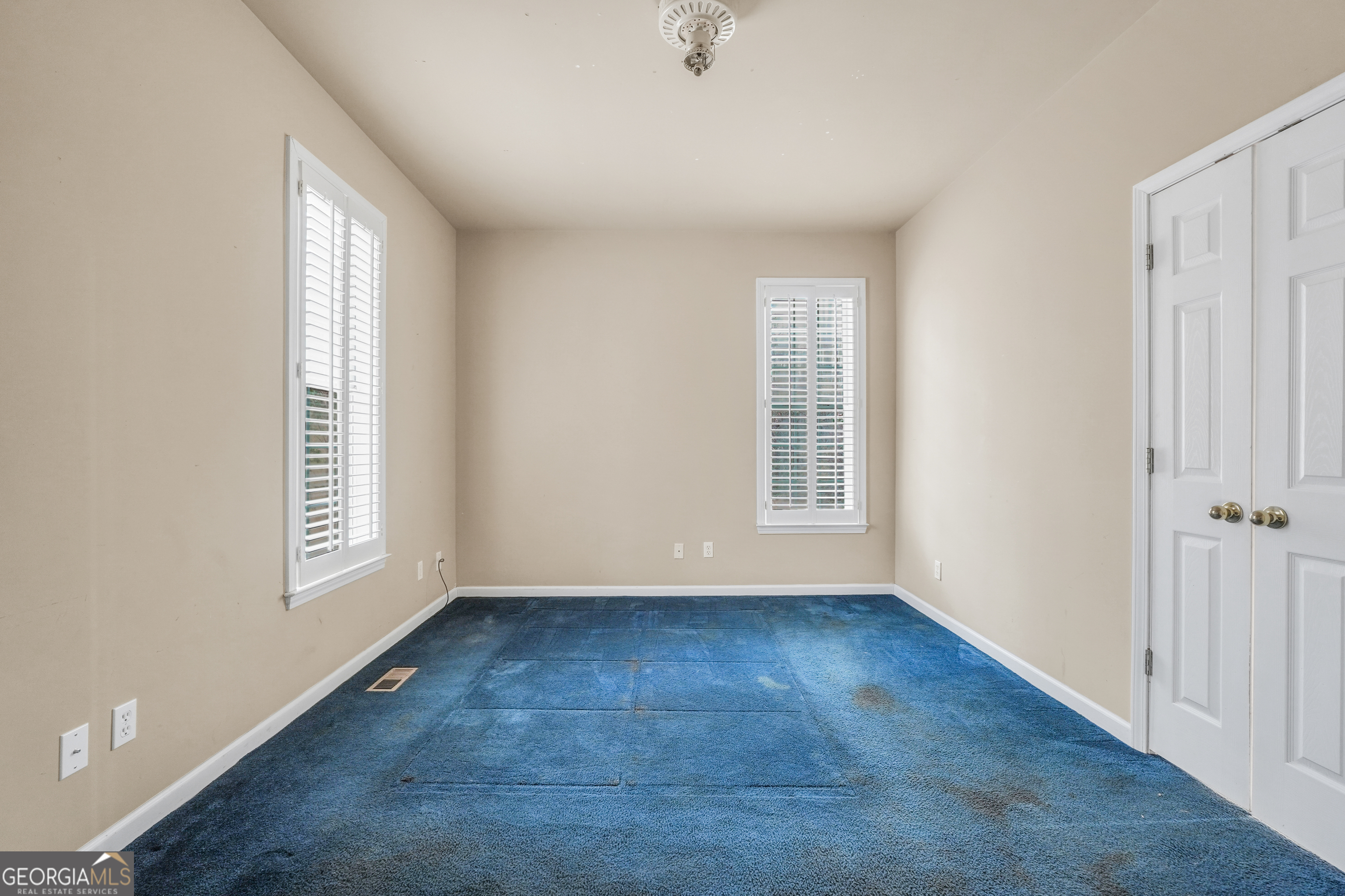 3003 Southwest East Fairview Road McDonough, GA 30252 - Photo 26 of 48 a view of an empty room with wooden floor and a window