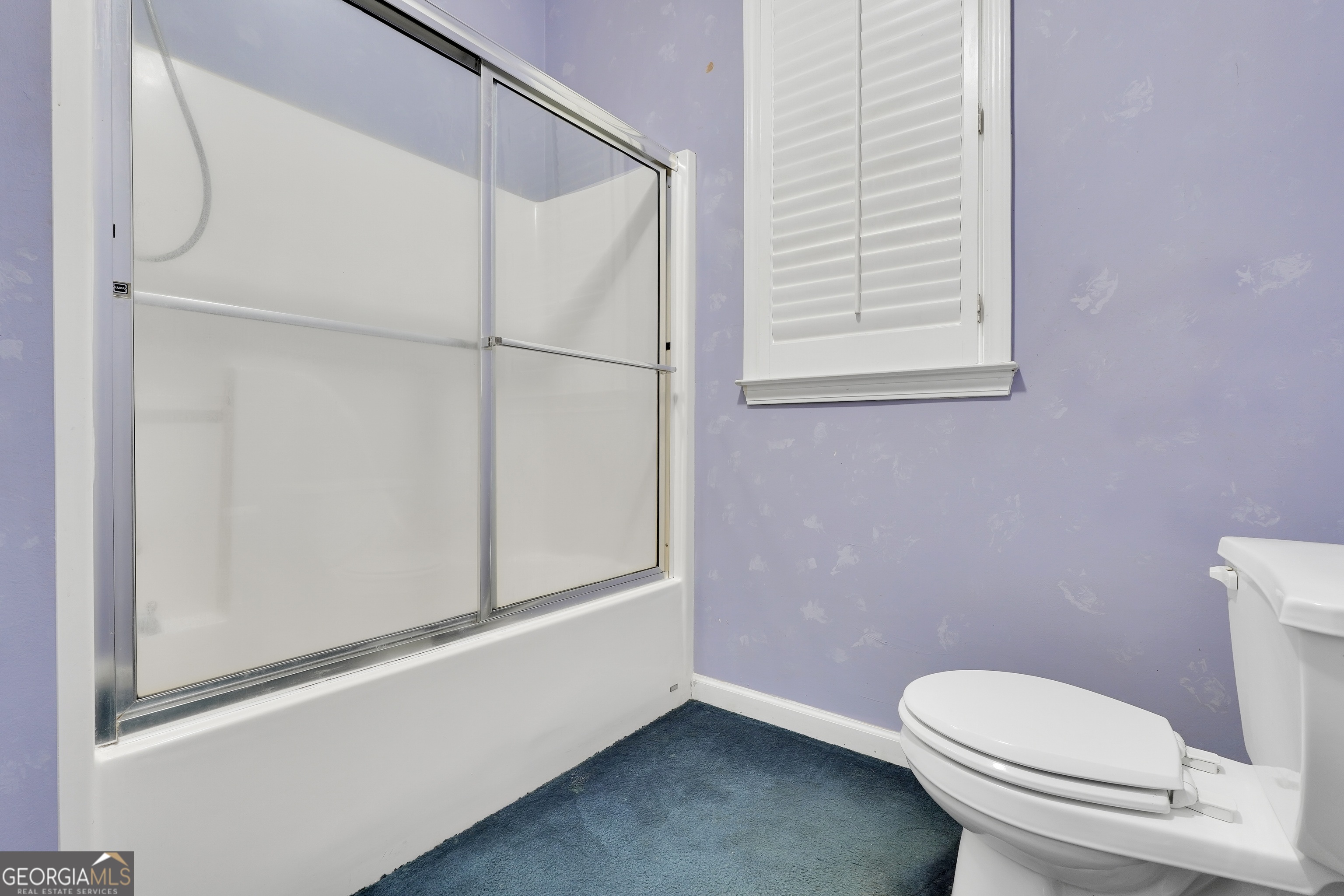 3003 Southwest East Fairview Road McDonough, GA 30252 - Photo 27 of 48 a white toilet sitting next to a window