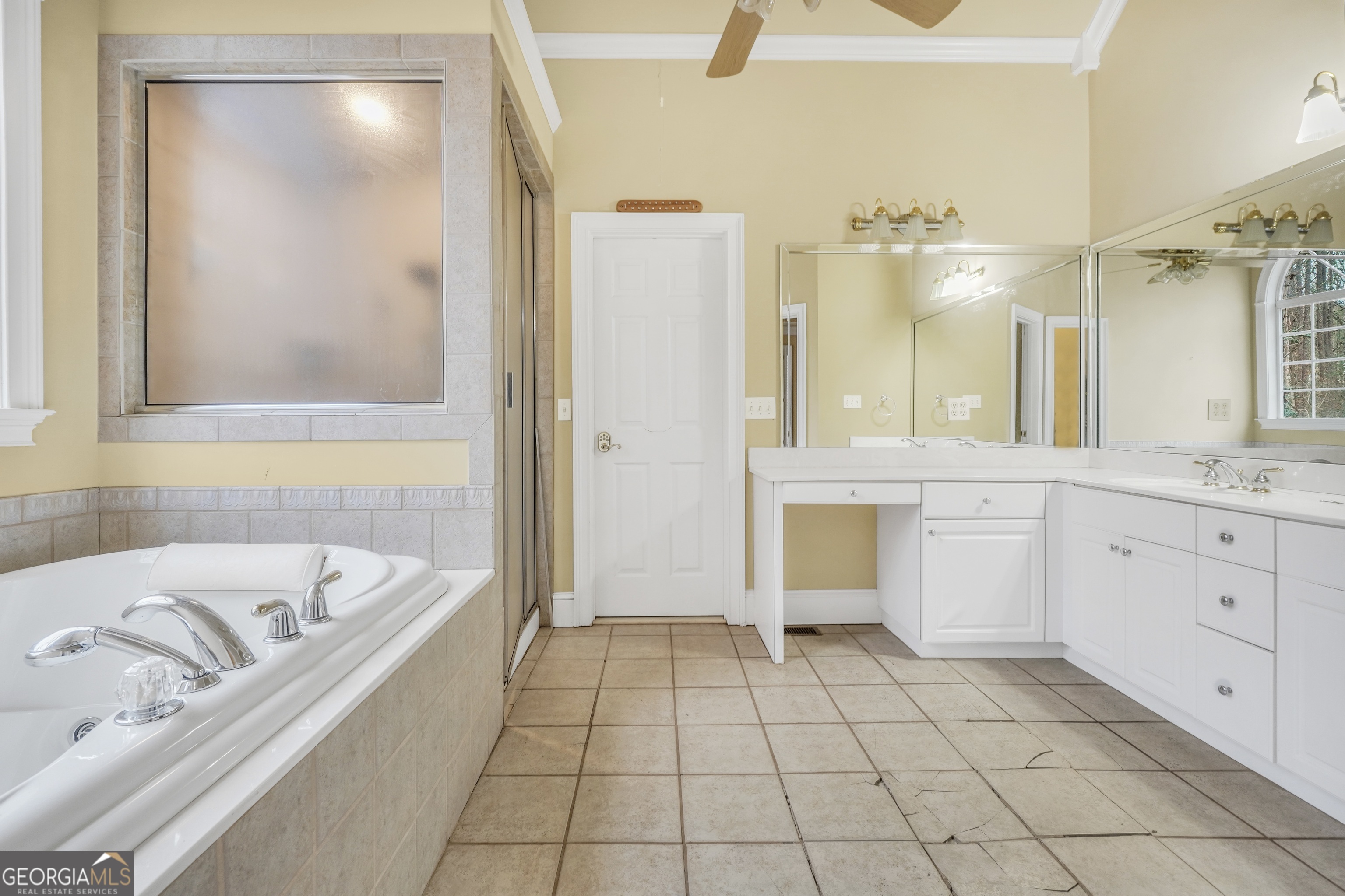 3003 Southwest East Fairview Road McDonough, GA 30252 - Photo 32 of 48 a bathroom with a tub a sink and a mirror