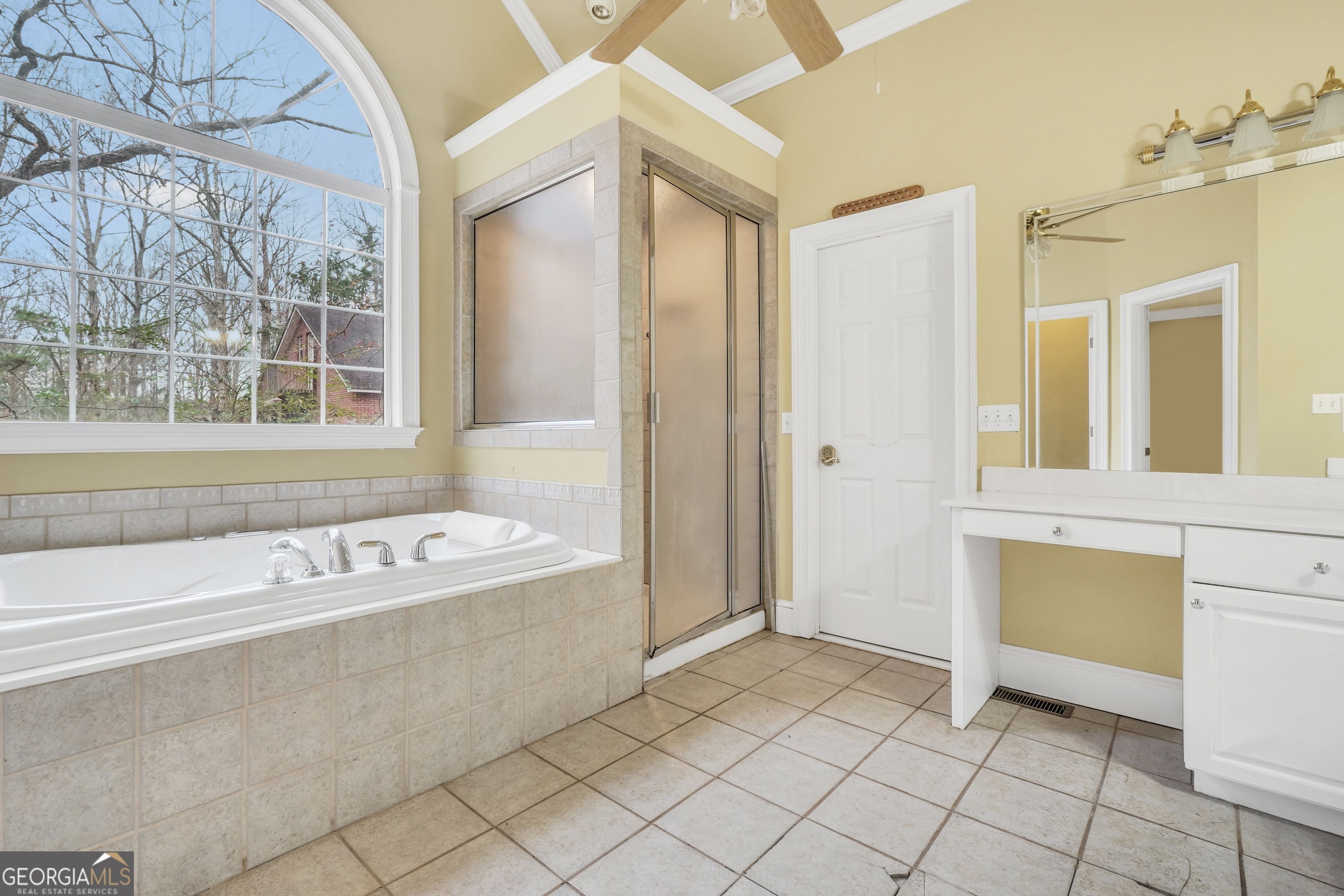 3003 Southwest East Fairview Road McDonough, GA 30252 - Photo 33 of 48 a bathroom with a bathtub and a shower