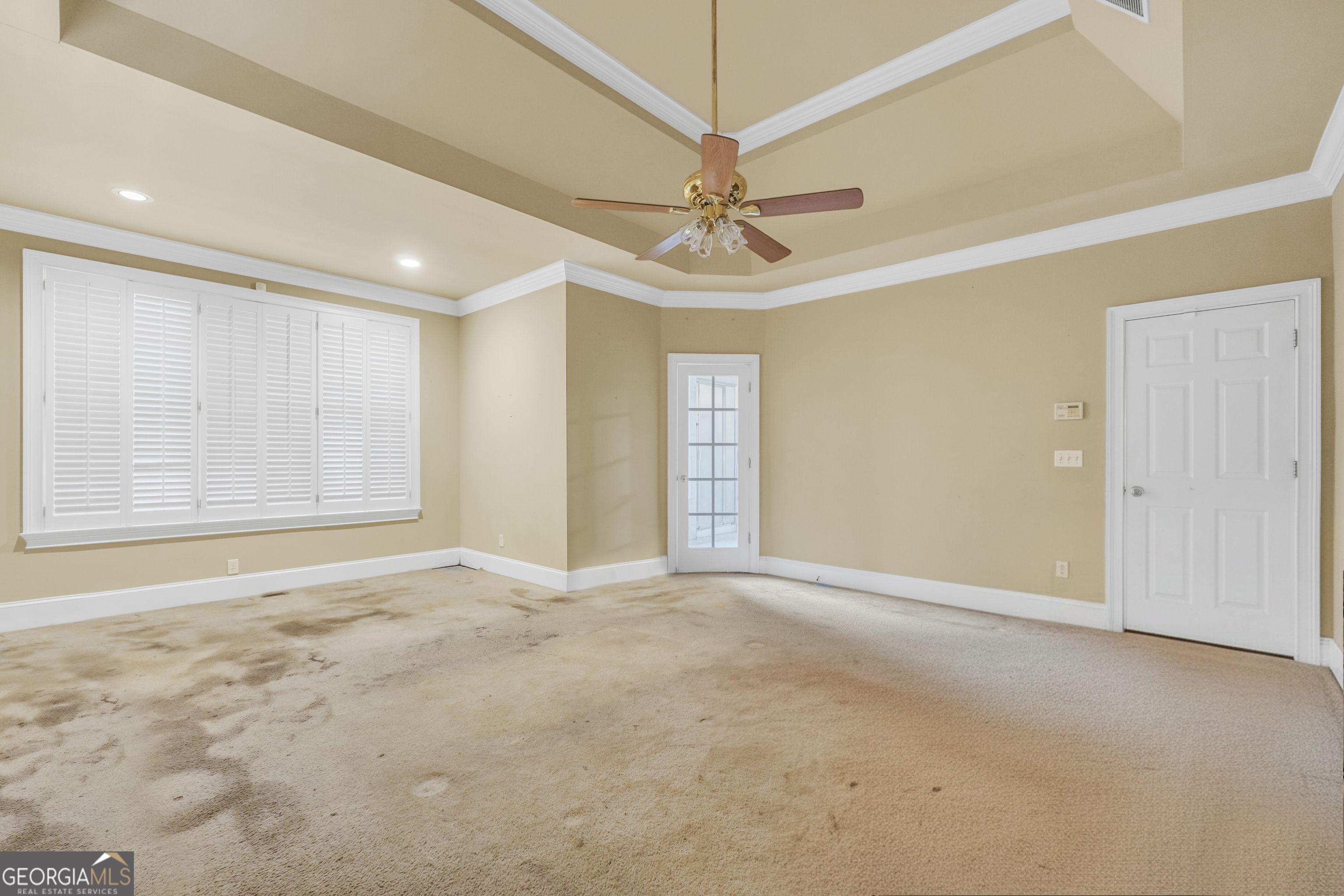 3003 Southwest East Fairview Road McDonough, GA 30252 - Photo 37 of 48 an empty room with windows and fan