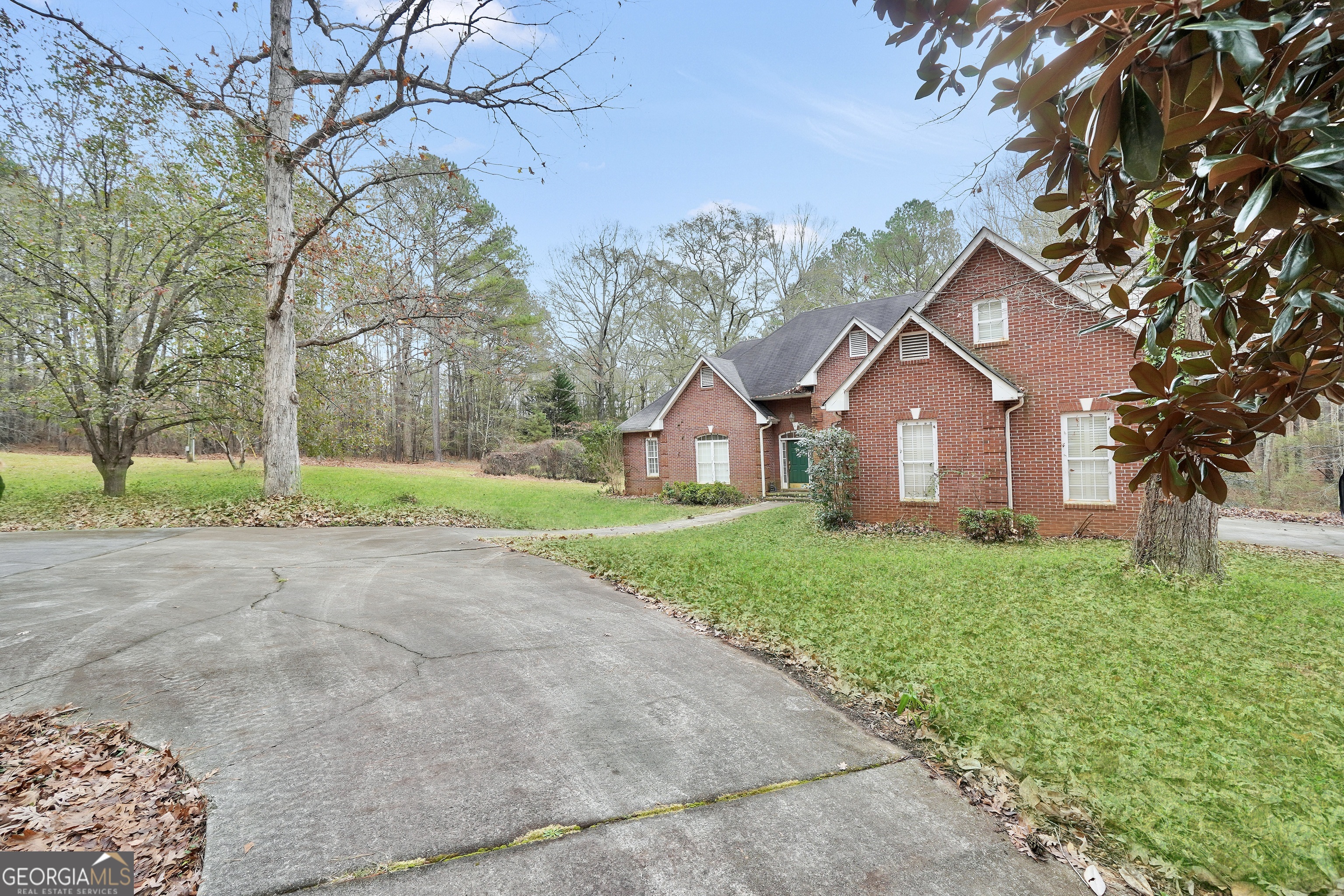 3003 Southwest East Fairview Road McDonough, GA 30252 - Photo 48 of 48 a front view of a house with garden