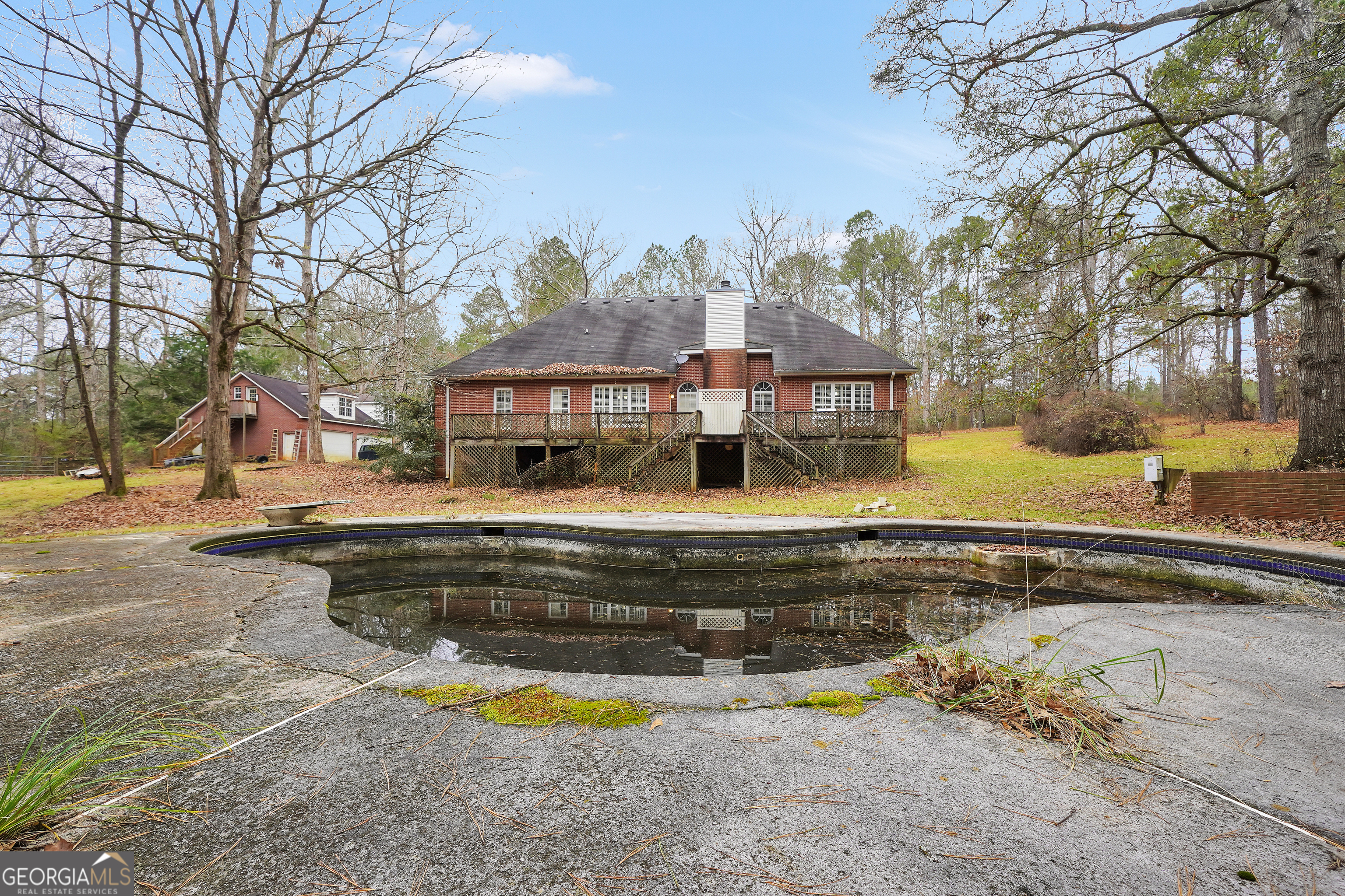 3003 Southwest East Fairview Road McDonough, GA 30252 - Photo 7 of 48 a view of a swimming pool with a lounge chairs