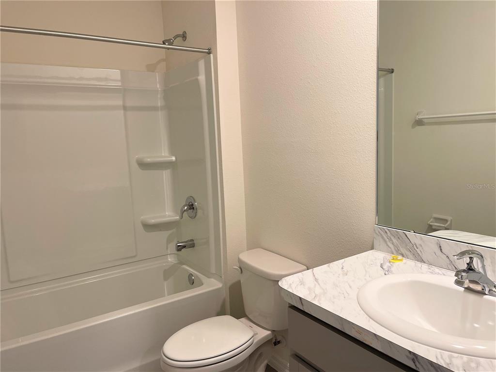 5105 Sultana Cove Bradenton, FL 34211 - Photo 12 of 23 a bathroom with a sink toilet and shower