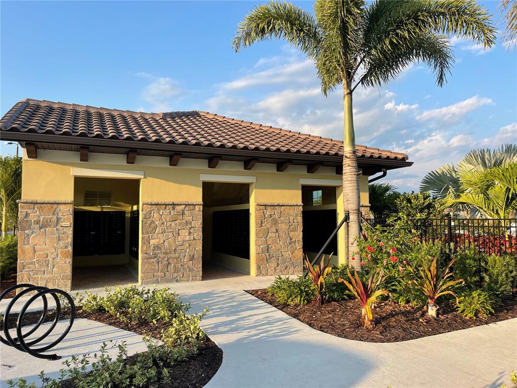 5105 Sultana Cove Bradenton, FL 34211 - Photo 16 of 23 a front view of a house with garden