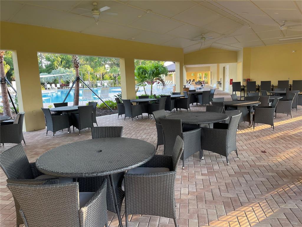 5105 Sultana Cove Bradenton, FL 34211 - Photo 18 of 23 a view of a dining room with furniture window and outside view