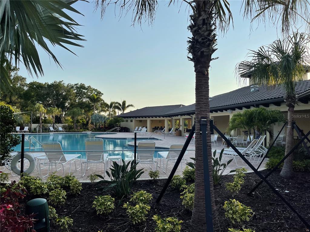 5105 Sultana Cove Bradenton, FL 34211 - Photo 19 of 23 a view of a backyard of a house with a lake view