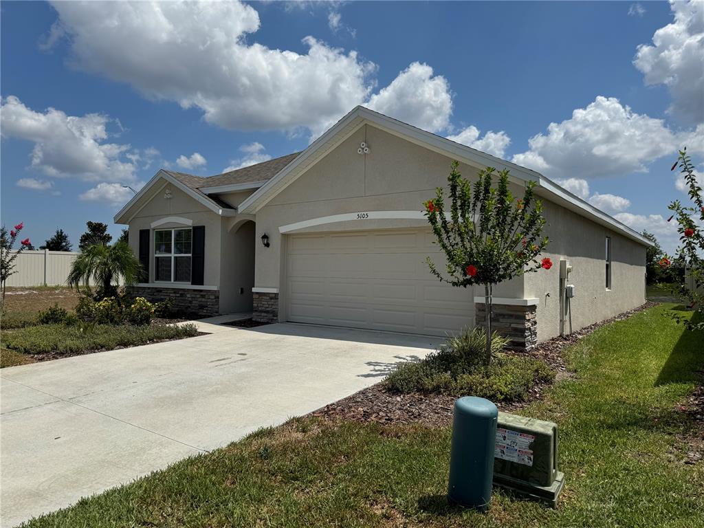 5105 Sultana Cove Bradenton, FL 34211 - Photo 3 of 23 a front view of a house with garden