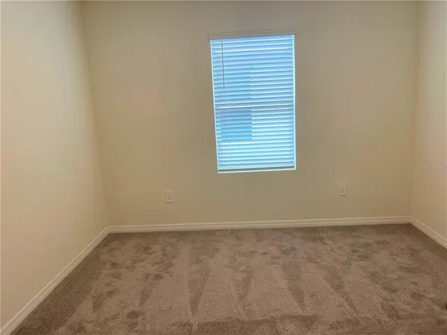 a bathroom with a shower sink vanity and mirror