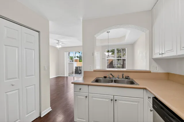a kitchen with sink and cabinets