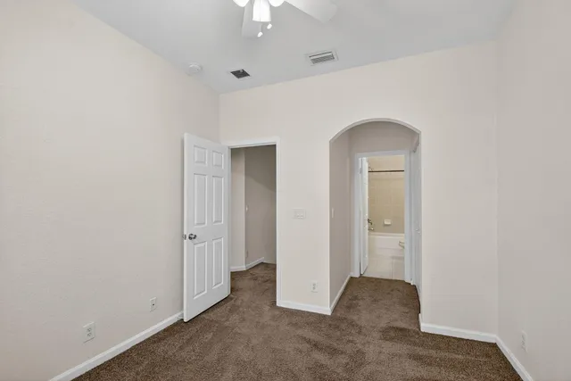 an empty room with a bathroom