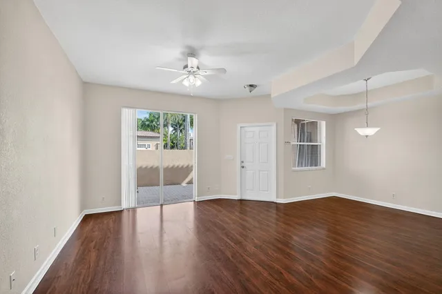 a view of livingroom with hardwood floor and ceiling fan