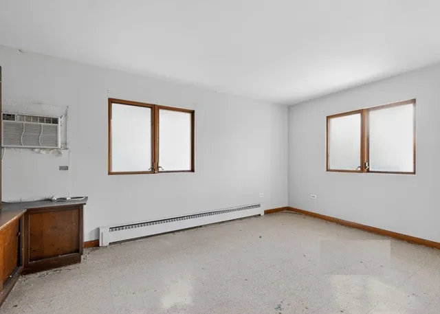 a view of an empty room with a window