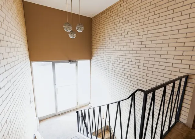 an empty room with closet and a bathroom