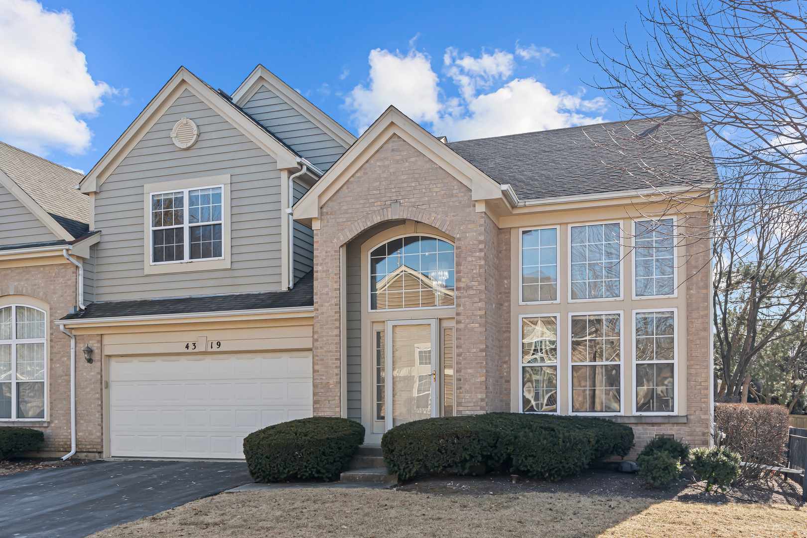 a front view of a house with a yard