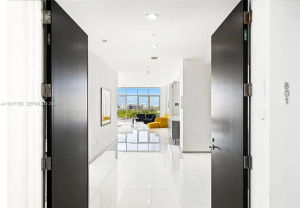 a view of a living room with a refrigerator