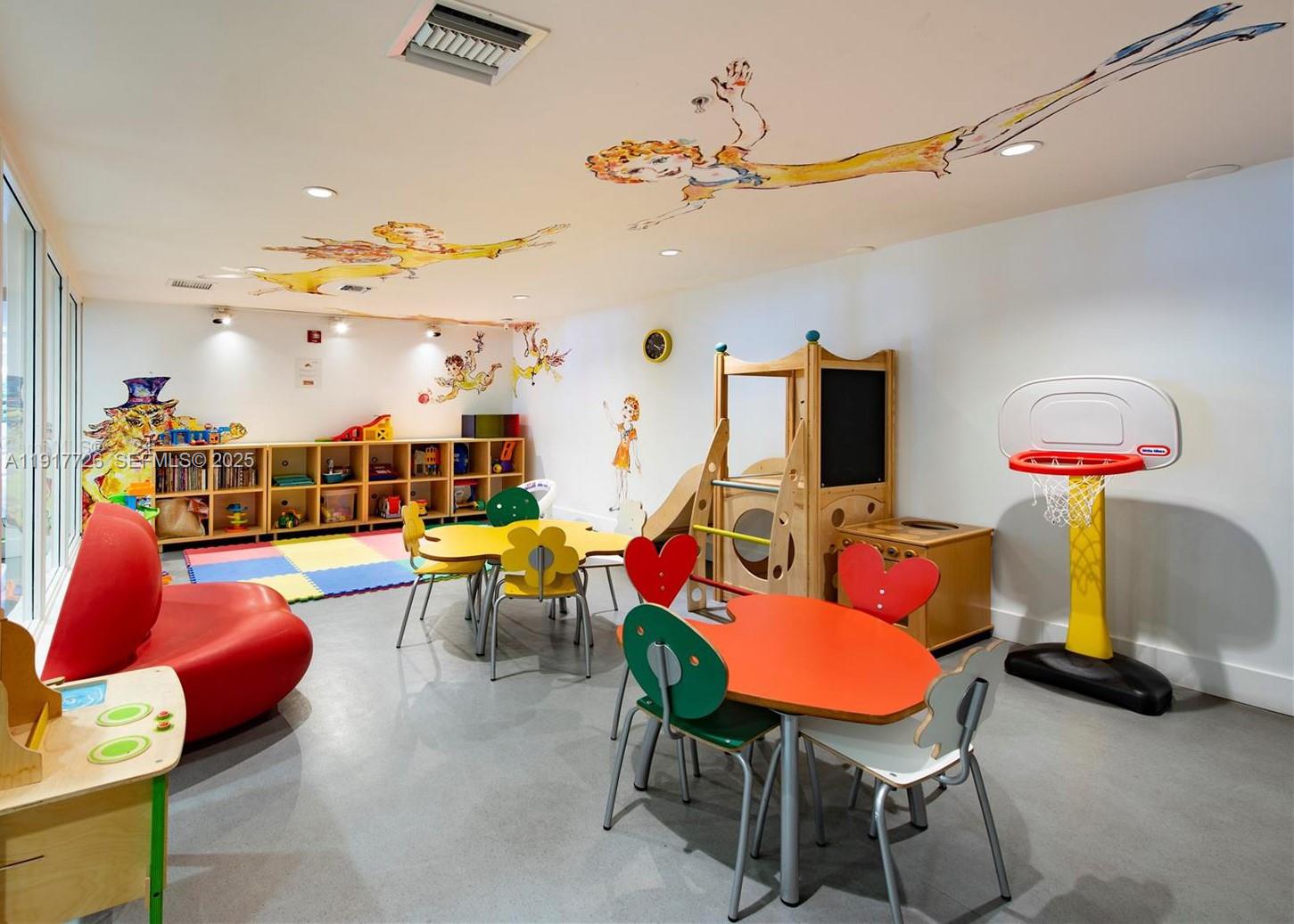 201 Aqua Avenue, Unit 801 Miami Beach, FL 33141 - Photo 40 of 49 a living room with furniture and a flat screen tv