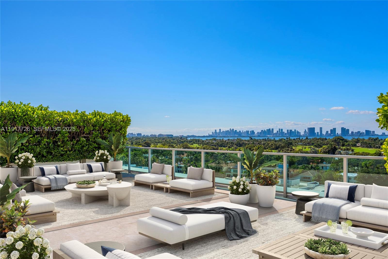 201 Aqua Avenue, Unit 801 Miami Beach, FL 33141 - Photo 4 of 49 a view of a patio with couches and city view