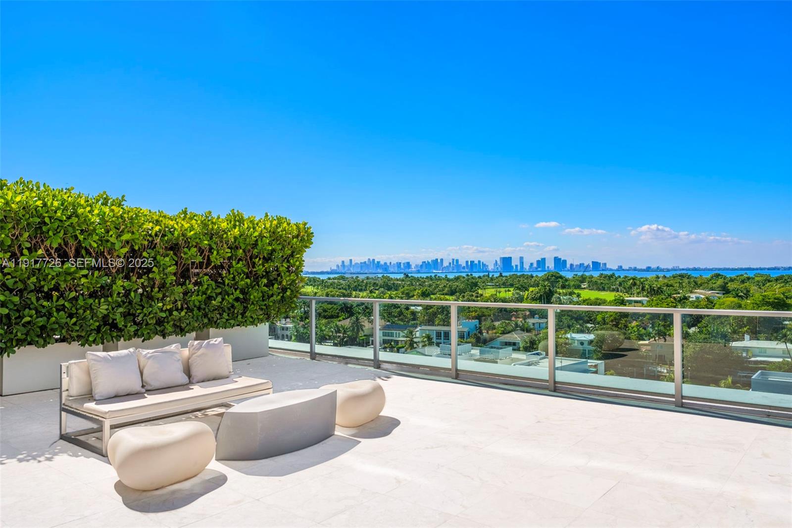 201 Aqua Avenue, Unit 801 Miami Beach, FL 33141 - Photo 7 of 49 a view of a roof deck with couches and sky view