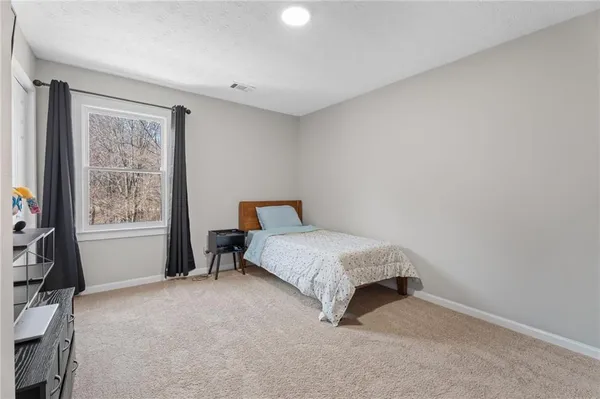 a room with furniture and a flat screen tv