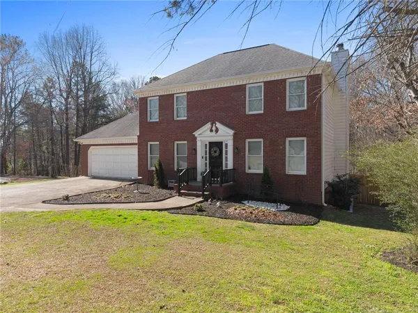 a front view of a house with swimming pool