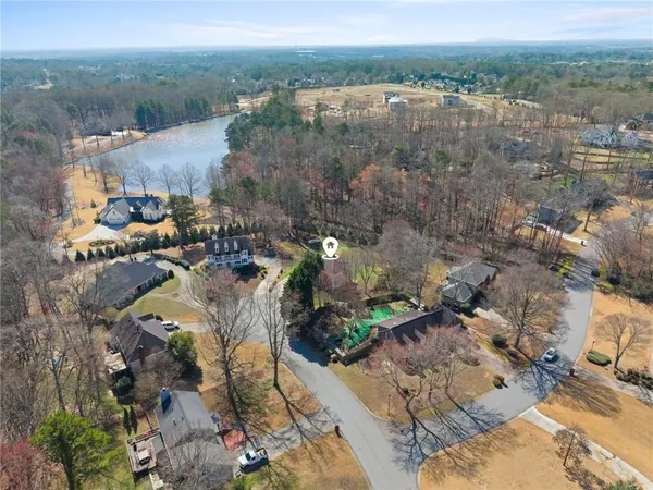 an aerial view of a house with a yard