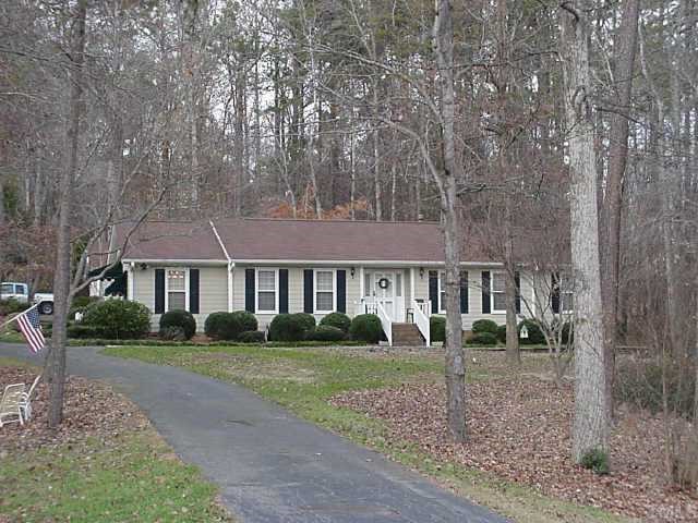 5619 Russell Road Durham, NC 27712 - Photo 1 of 1 a front view of a house with garden