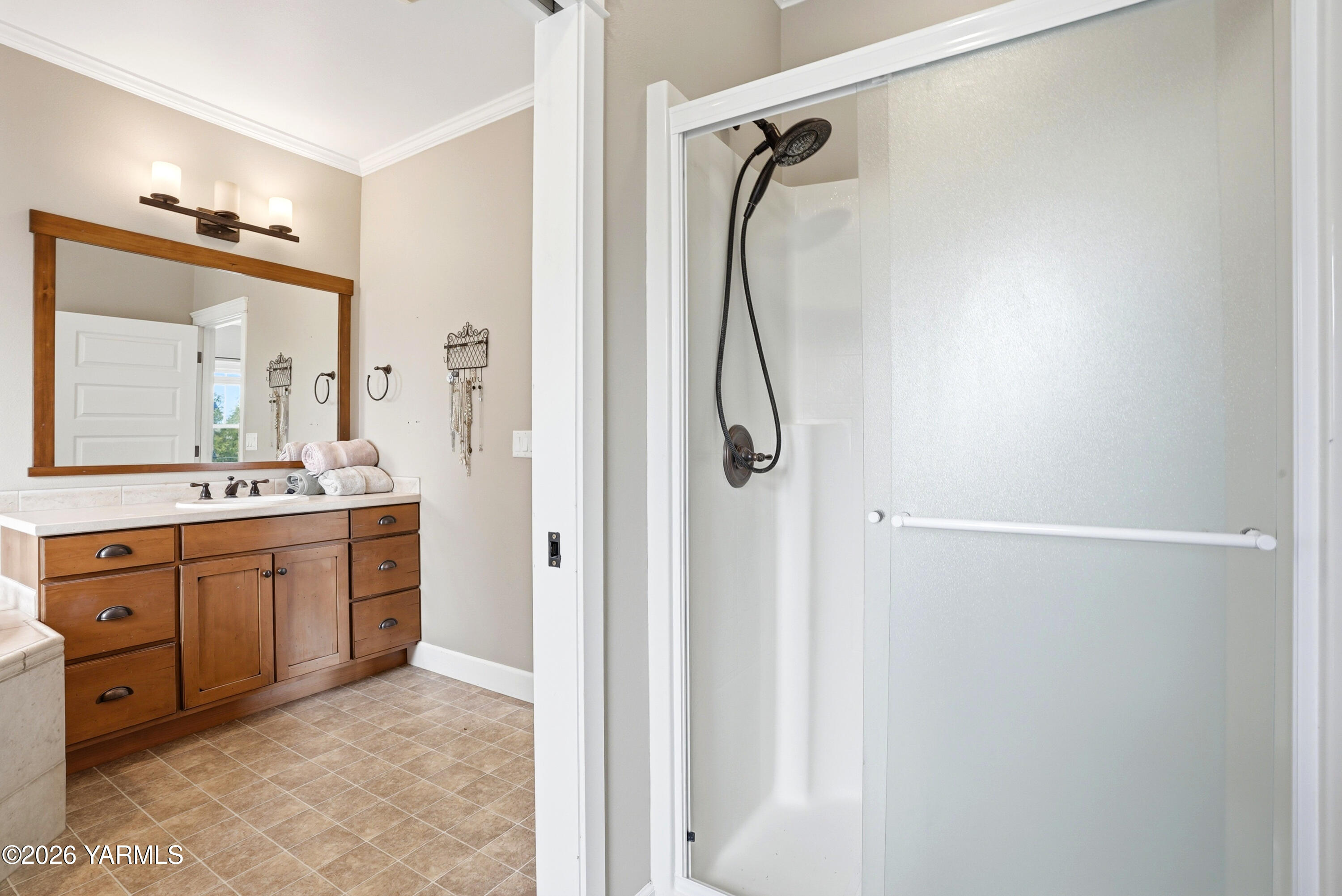 230 Albro Road Sunnyside, WA 98944 - Photo 21 of 46 a bathroom with a granite countertop shower sink vanity and mirror