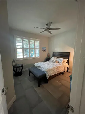 a bedroom with a bed and a couch